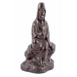 Bronze sculpture of a Quanyin sitting on a rock, 34 cm high