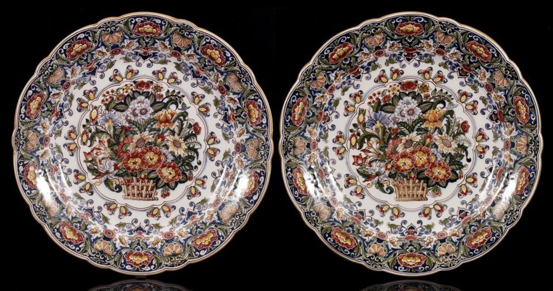 2 Tichelaar Makkum earthenware decorative dishes with polychrome flower decoration and flower basket
