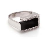 Modern white gold fantasy ring, 14 krt., Set with onyx and octagon cut diamond, approx. 0.15 ct.,