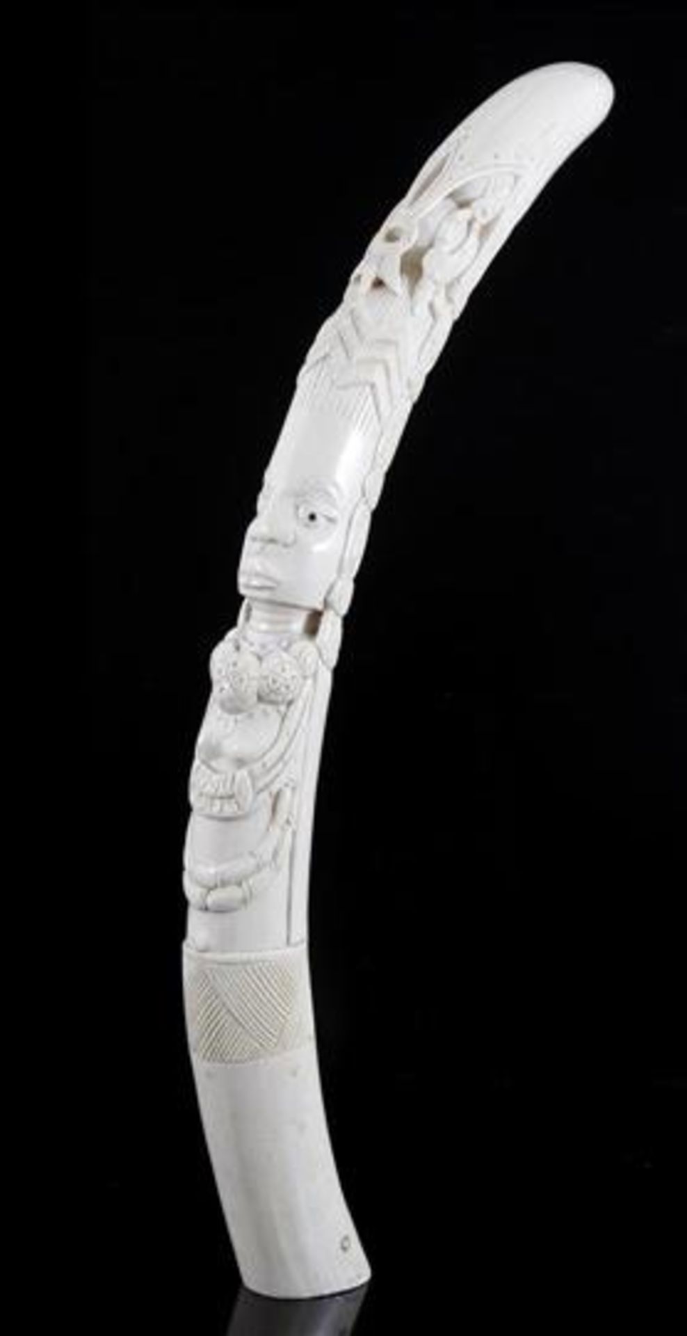 Richly carved ivory tooth with a hand-carved representation of a person with decorative ornaments. - Image 2 of 2