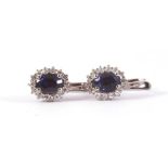 White gold earrings, 18 krt., Set with sapphire approx. 2.00 ct. And brilliant cut diamond approx.