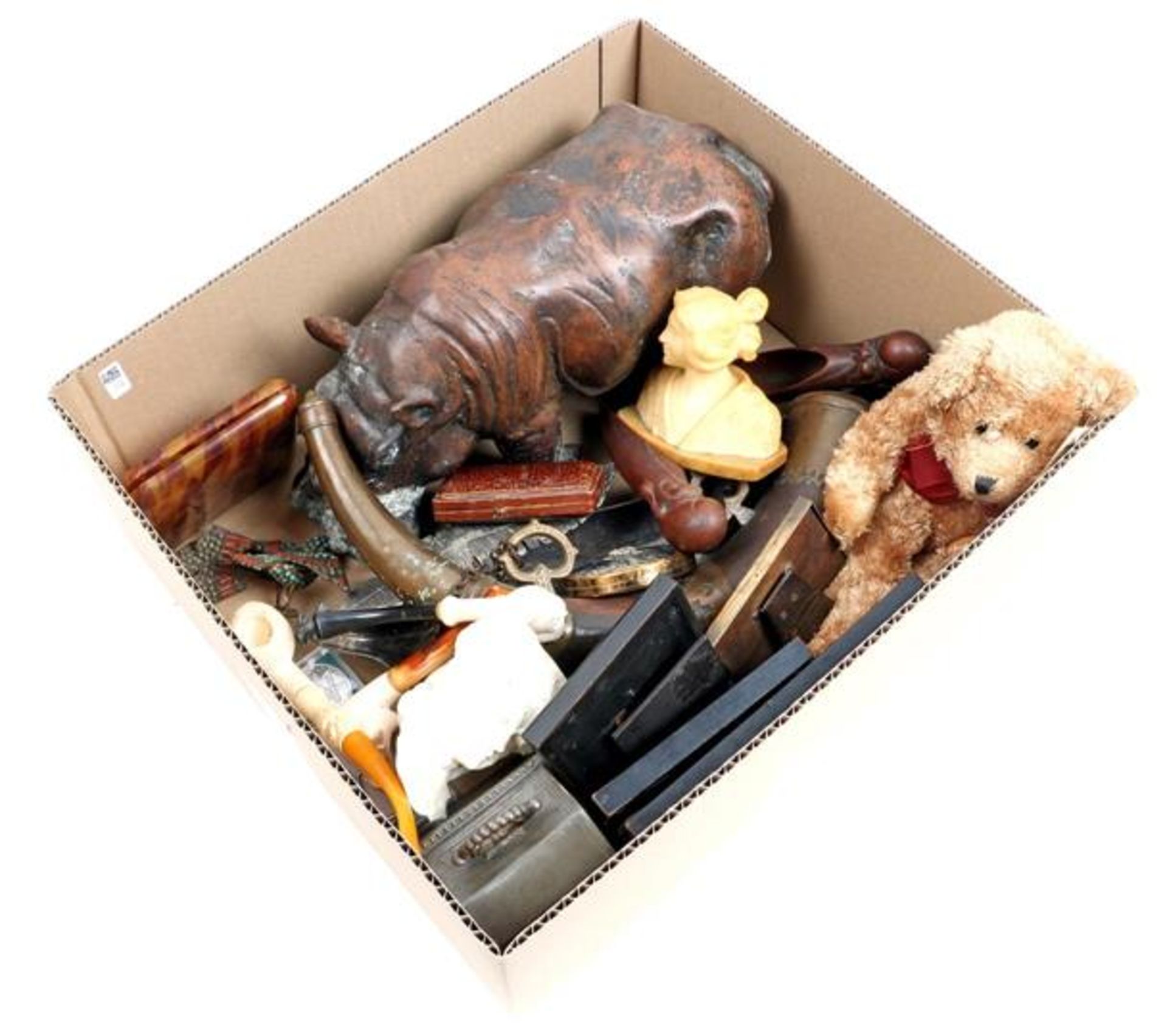 Box of various curiosities including statue of a hippo