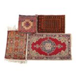 3 Oriental hand-knotted rugs 63x43 cm, 67x43 cm, 97x59 cm and pillow 42x41 cm