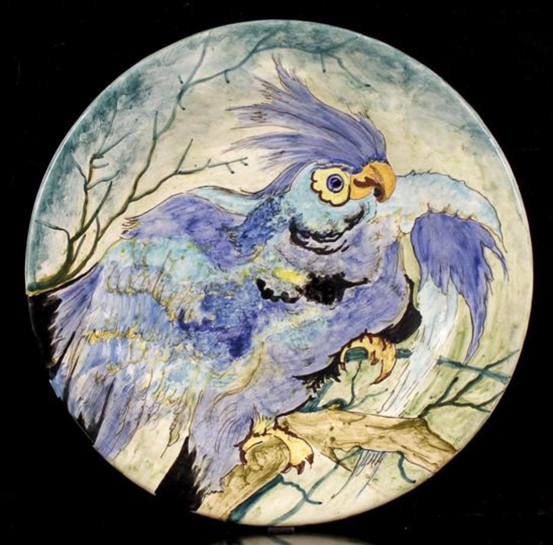 Gouda Holland earthenware dish with parrot decoration, 35 cm diameter