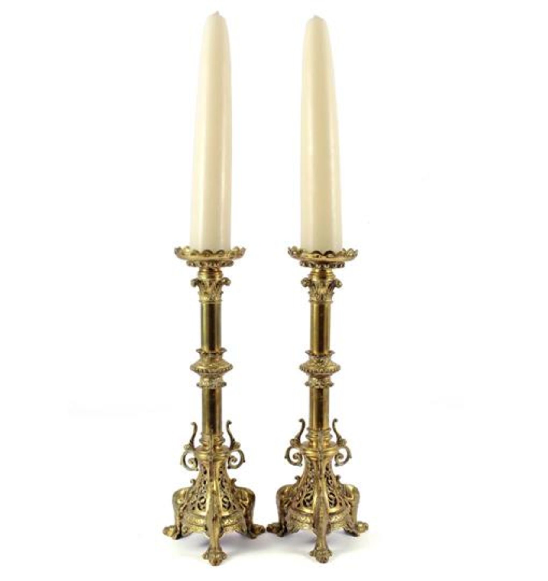 2 copper richly decorated pin candlesticks with dogs at the base 50 cm high, with 2 candles in total