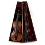 Old violin with various bows in wooden case