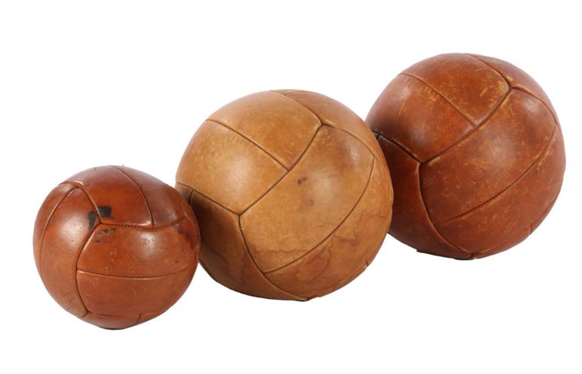 3 heavy leather balls, so-called medicine balls, 30, 29 and 22 cm in diameter