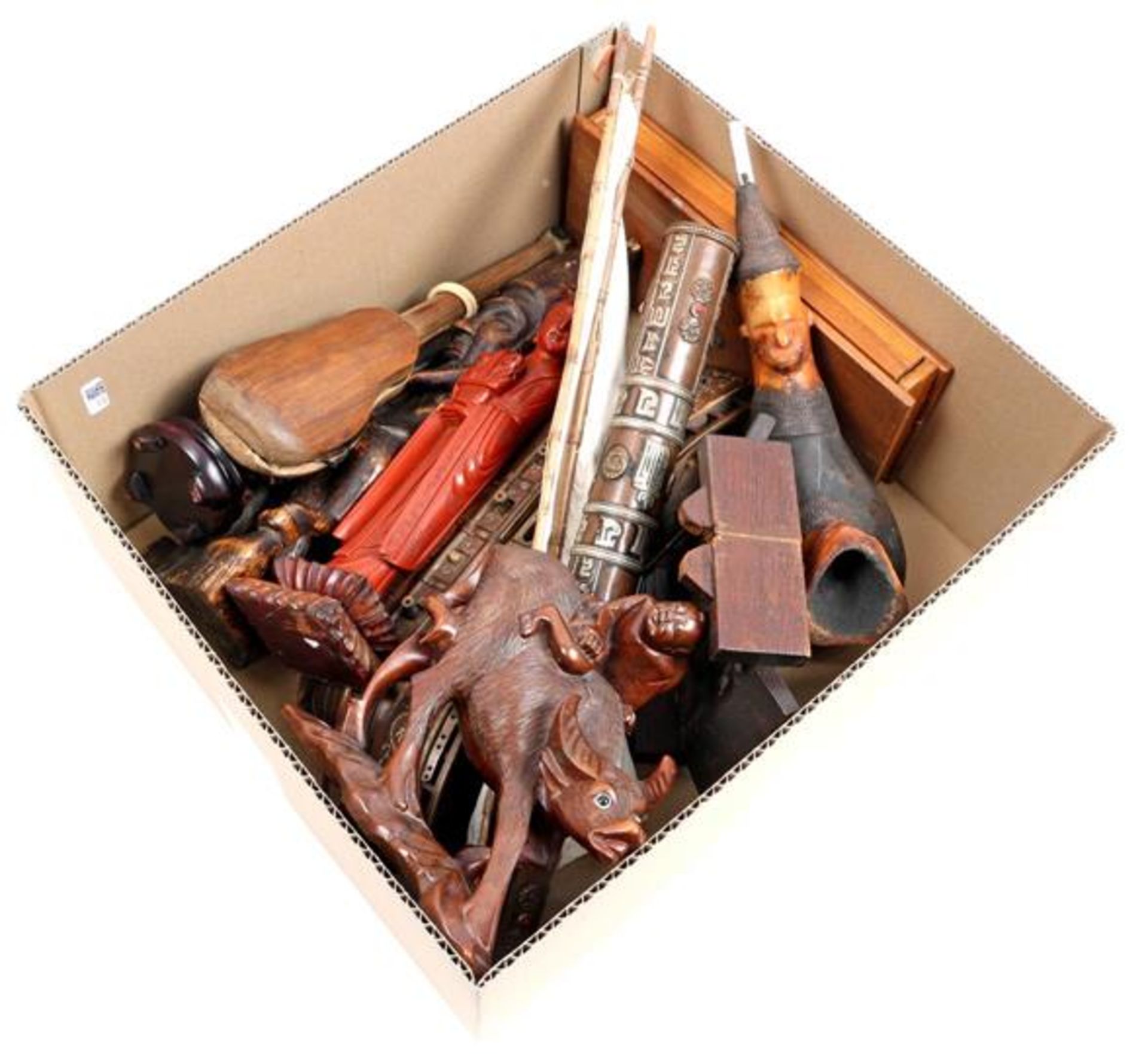 Box of various wooden objects including weighing scales, carabao, scale model boat etc.