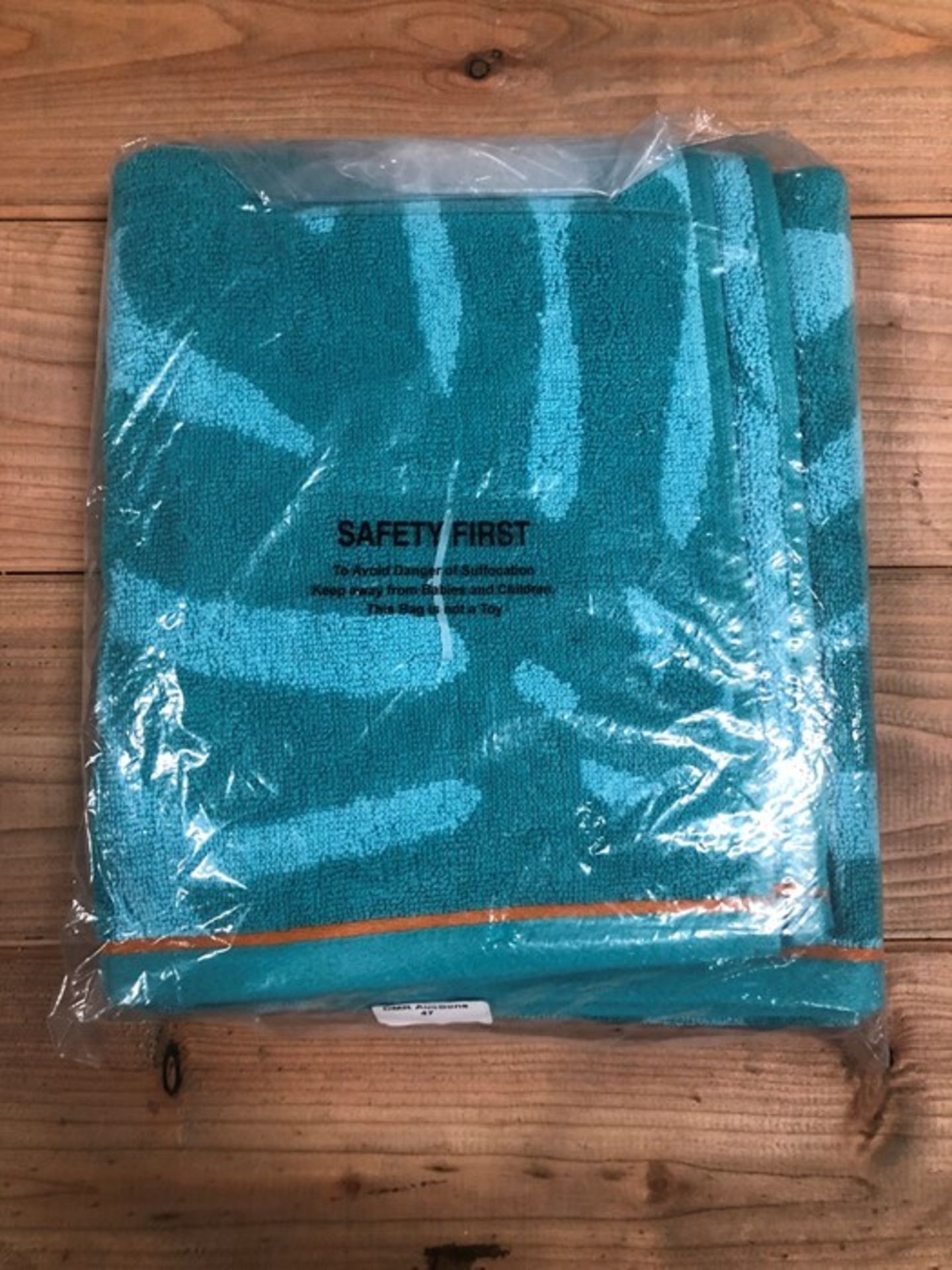 1 AS NEW BAGGED GOOD VIBES HAND TOWEL IN TEAL (PUBLIC VIEWING AVAILABLE)