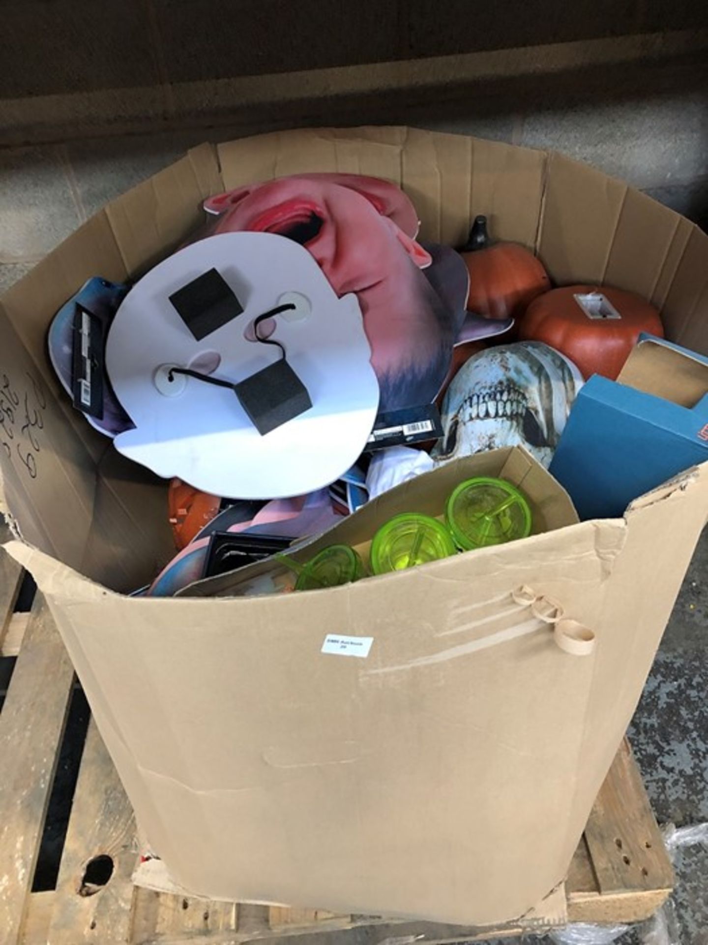 1 LOT TO CONTAIN 1 HALF PALLET SIZED BOX OF HALLOWEEN MASKS , CUPS , LIGHTS AND ASSORTED TOYS AND