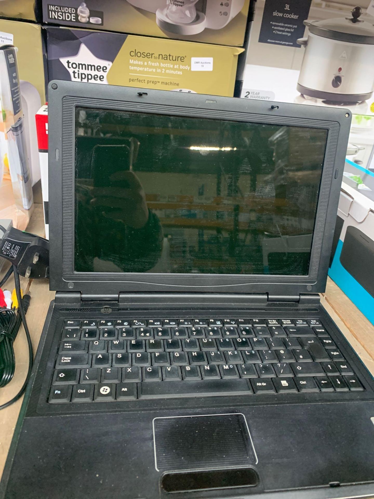 1 LOT TO CONTAIN 1 WINDOWS E SYSTEM LAPTOP (THIS ITEM IS AN UNTESTED CUSTOMER RETURN. PUBLIC VIEWING