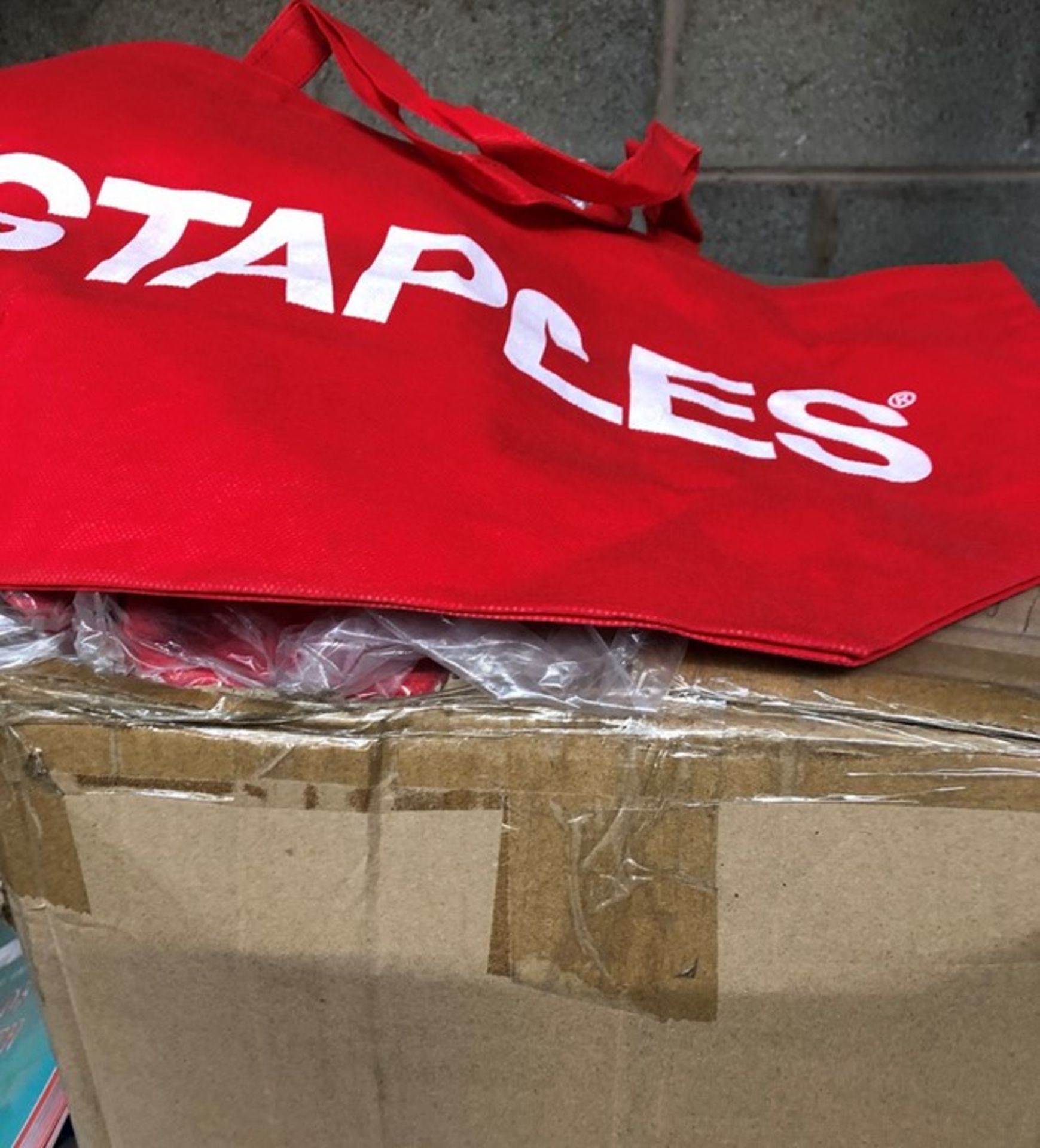 1 LOT TO CONTAIN APPROX 300 STAPLES RED FABRIC SHOPPING TYPE BAGS - BOXED -