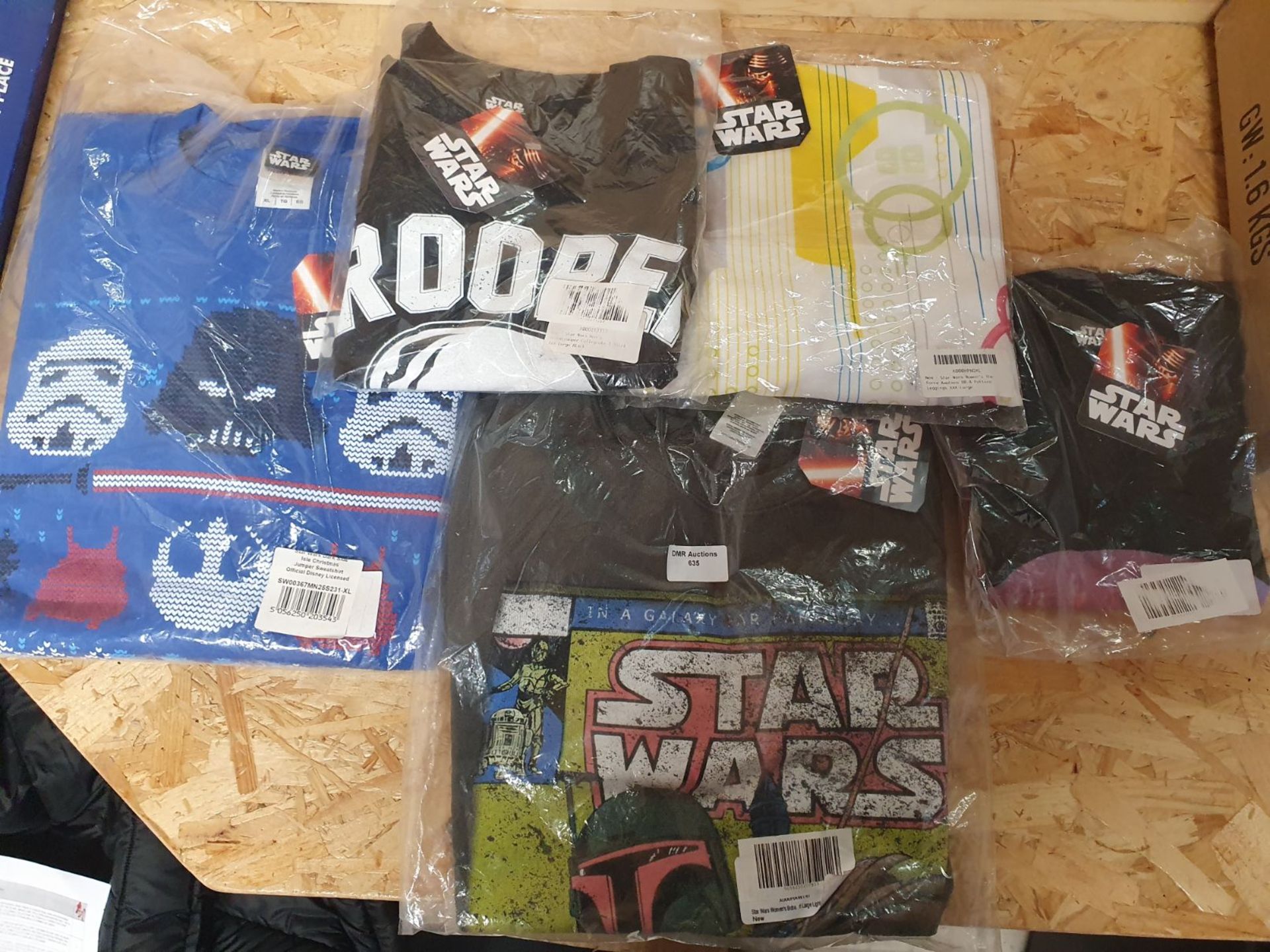 ONE LOT TO CONTAIN AN ASSORTMENT OF STAR WARS BRANDED CLOTHING. ALL IN ORIGINAL PACKAGING. MIXTURE