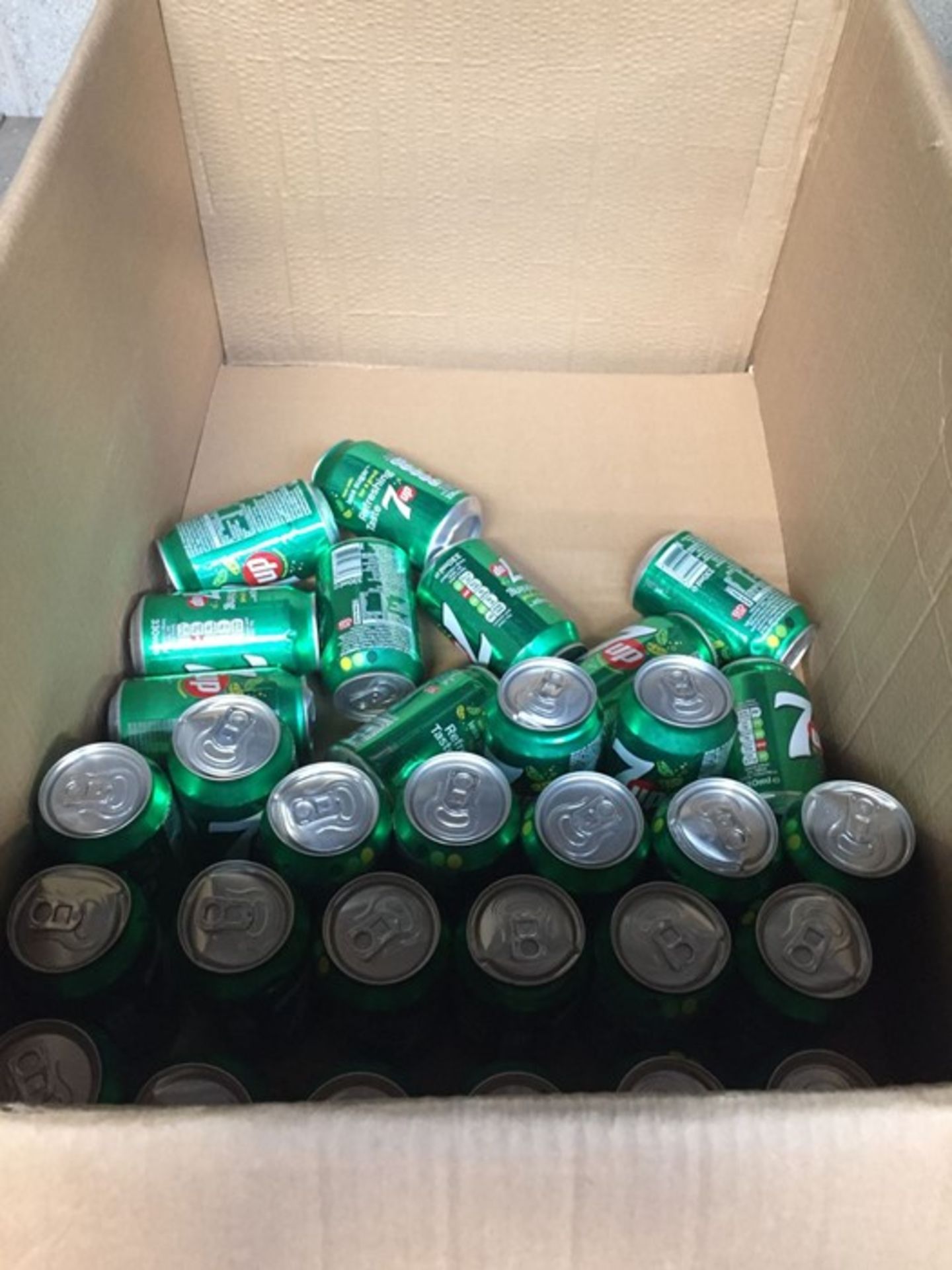 1 LOT TO CONTAIN A BOX OF 31 CANS OF 7UP, SOME OF THE CANS ARE DAMAGED BUT HAVEN'T OPENED BB