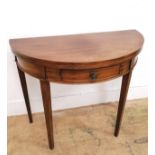 A 19th century demi lune flip top table having a single central drawer over tapering supports.