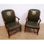 A pair of 19th century mahogany office arm chairs having green leather back support arm rest and