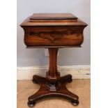 A 19th century rosewood teapoy having a sarcophagus shaped top over turned support raised on bun