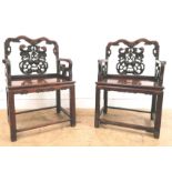 A pair of Chinese19th century Hongmu armchairs, the splats carved and pierced with pears dragon