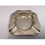 A Sheffield silver ash tray dated 1944. 10 cm in width. Approximately 94g