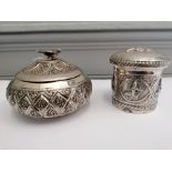 Two late 19th century Indian white metal pots with covers (a.f)