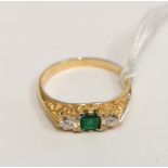 0.750 (18ct) Three stone emerald and diamond ring, London 1995