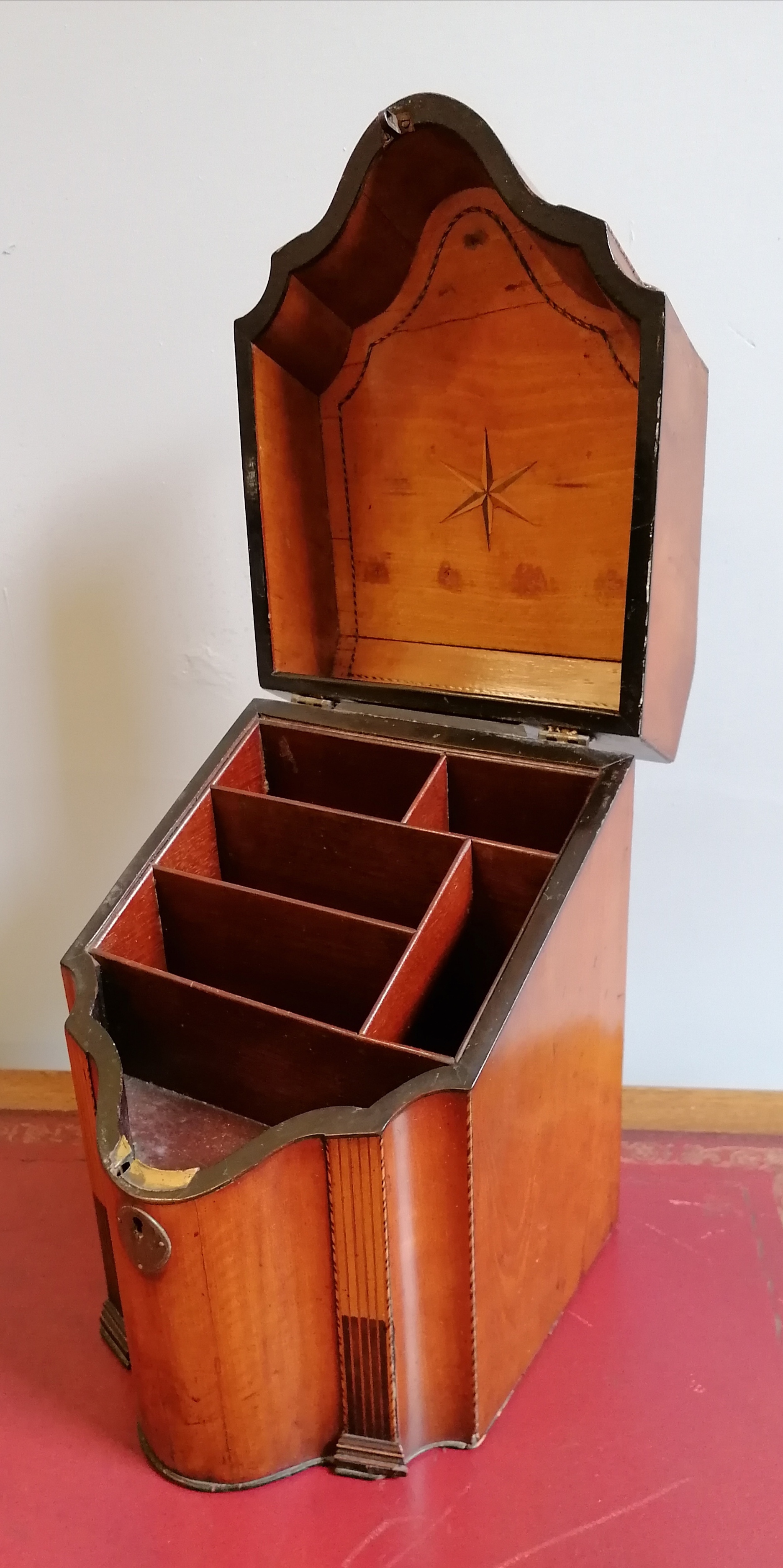 A Georgian mahogany and inlaid knife box converted to a stationary box having a shaped lid enclosing