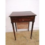 A Regency mahogany work table having fitted drawer to front flanked by two faux drawers above work