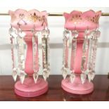 A pair of 19th century pink glass lustres complete with prismatic drops