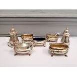 A collection of seven miscellaneous silver condiments featuring two peppers and five mustard/