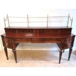 A large Georgian mahogany sideboard having a gallery and stepped top above five short drawers,