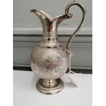 A William Marshall silver cream jug having ornately repousse/chased form on spread pedestal base