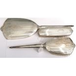 A Birmingham silver dressing set by Charles S Green & Co Ltd, comprising of hand mirror and two