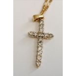 12ct and diamond crucifix on a 9ct curb chain, 0.45cts diamonds.