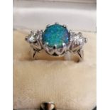 Fine 0.750 (18ct) Black opal (Lightening Ridge) and diamond dress ring, the diamonds 2 x 0.55ct