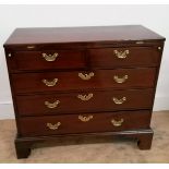 A George II mahogany bachelors chest having a flip top above two short and three graduating