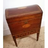 A 19th century domed top mahogany and marquetry inlaid cellarette, having a fitted interior over