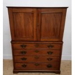 A 19th century mahogany seaman’s chest having removable linen press to top revealing writing slope