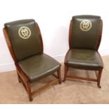 A pair of 19th century mahogany office chairs having green leather back support and seat with MM