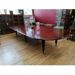 A 19th century mahogany dining table of large proportions having an impress mark for makers M.