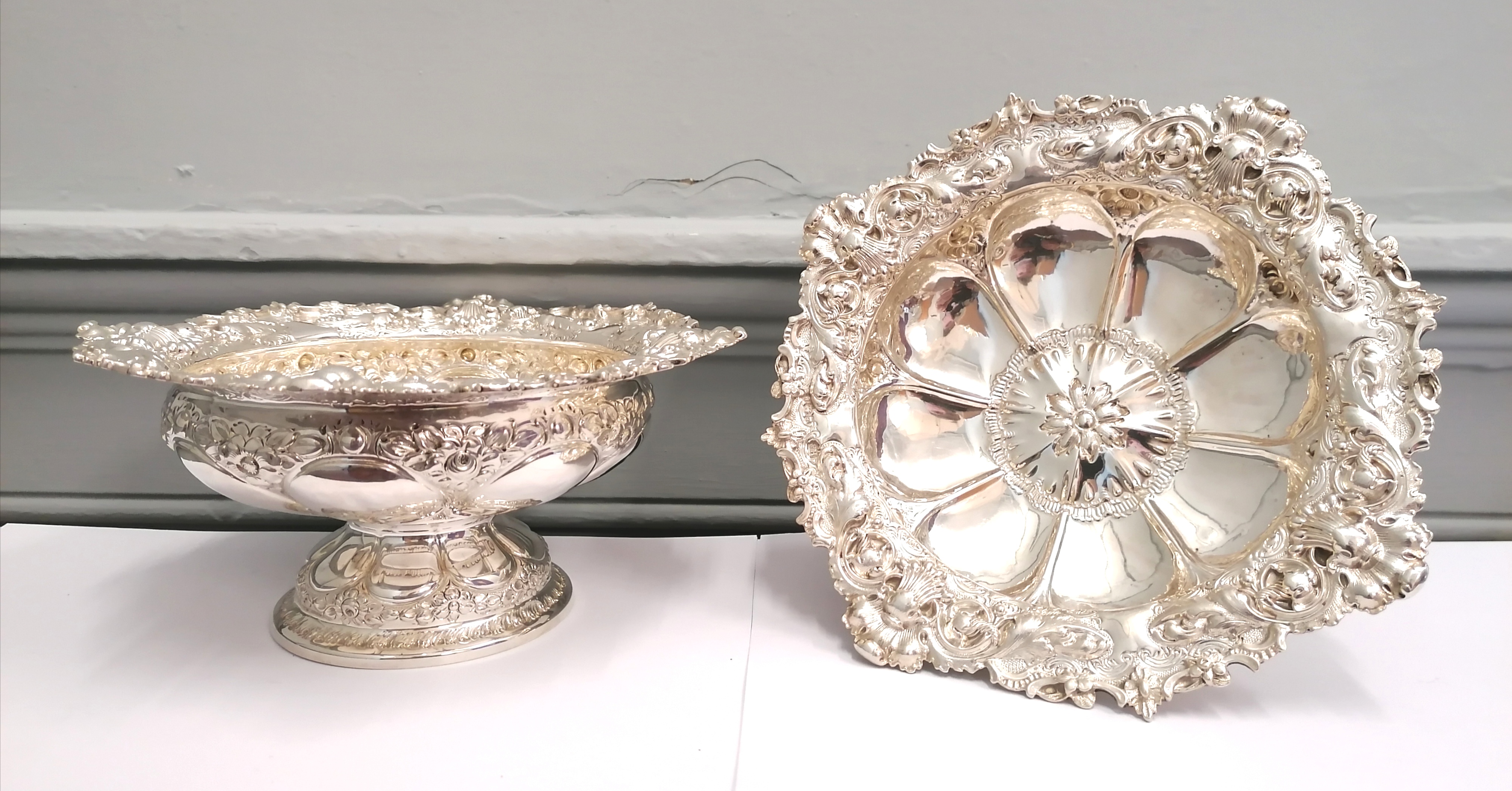 Fine pair of chased silver Victorian comports with floral decoration to the top rim and base,