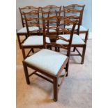 A set of six oak George III ladder back dining chairs having pieced shaped splats over insert