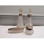 A miscellaneous collection of silver collared cut glass scent bottles together with a silver