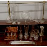 A large collection of scientific glass vials, test tubes and beakers together with a quantity of