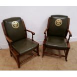 A pair of 19th century mahogany office arm chairs having green leather back support arm rest and