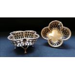 Matched pair of silver pierced quatrefoil bonbon dishes on claw feet. Makers Harry Synyer &