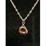 A 9ct gold chain with citrine pendant. 12g approximately.