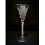 A Jacobean engraved air twist wine glass having a drawn bell bowl with engraved Jacobite rose,