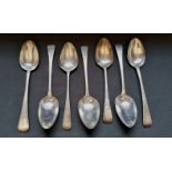 A collection of seven Georgian silver tablespoons all London with varying makers marks and date