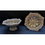 A fine pair of chased silver Victorian comports with floral decoration to the top rim and base.