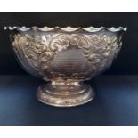 Silver fluted presentation comport style rose bowl decorated with foliate and floral chasing. Makers